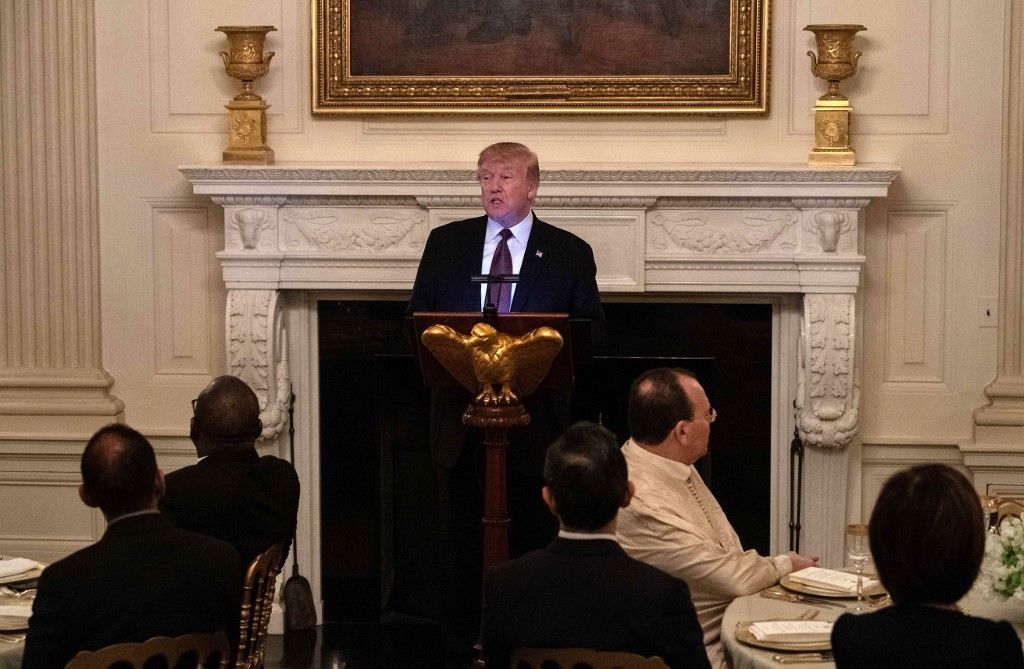 WASHINGTON, DC - MAY 13: U.S. President Donald Trump delivers greets guests at an Iftar dinner May 13, 2019 in Washington, DC. Iftar is the meal after sunset with which Muslims break their fast following Ramadan.   Win McNamee/Getty Images/AFP