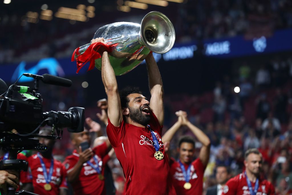 MADRID, SPAIN - JUNE 01: Mohamed Salah of Liverpool lifts the Champions League Trophy following the UEFA Champions League Final between Tottenham Hotspur and Liverpool at Estadio Wanda Metropolitano on June 01, 2019 in Madrid, Spain. (Photo by Clive Rose/Getty Images)
