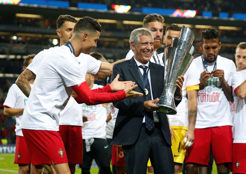 Soccer Football - UEFA Nations League Final - Portugal v Netherlands - Estadio do Dragao, Porto, Portugal - June 9, 2019  Portugal coach Fernando Santos celebrates winning the UEFA Nations League Final with the trophy          Action Images via Reuters/Carl Recine