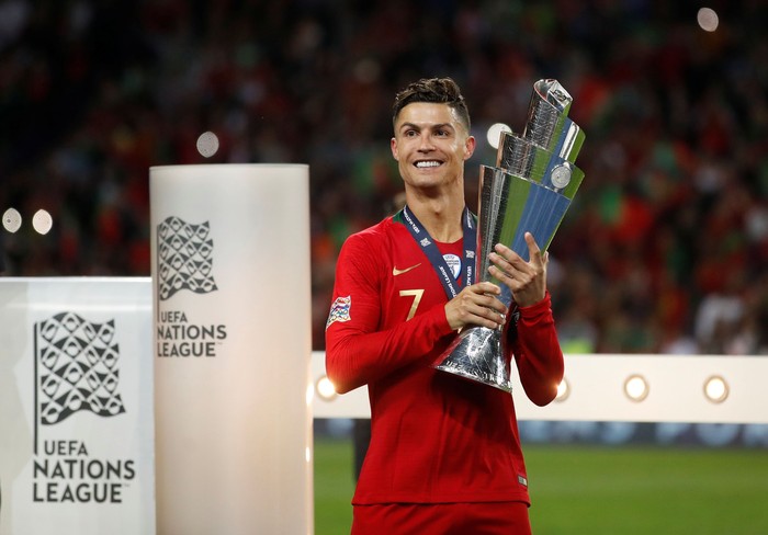 Cristiano Ronaldo Soccer Football - UEFA Nations League Final - Portugal v Netherlands - Estadio do Dragao, Porto, Portugal - June 9, 2019 Portugal's Cristiano Ronaldo celebrates winning the UEFA Nations League Final with the trophy Action Images via Reuters/Carl Recine