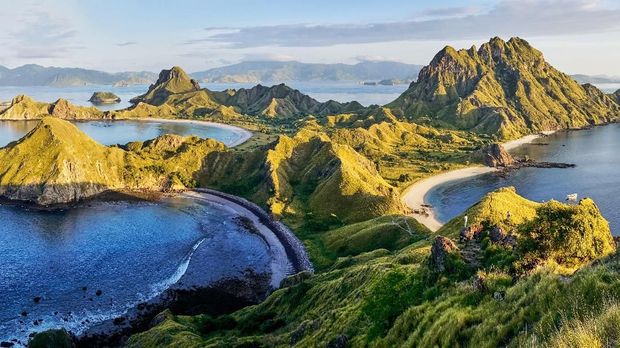 Panoramic warm view at top of 'Padar Island' in sunrise (late morning) from Komodo Island, Komodo National Park, Labuan Bajo, Flores, Indonesia. in summer