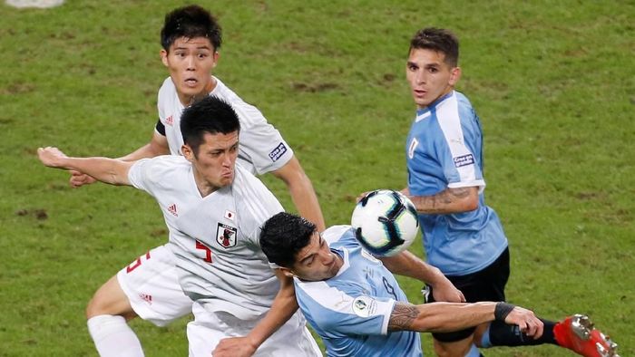 Uruguay berimbang 2-2 dengan Jepang. (Foto: Diego Vara/REUTERS)