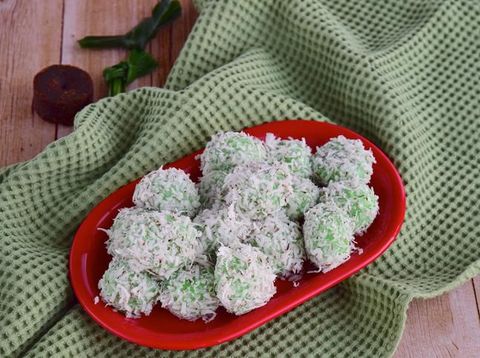 Indonesian Cuisine, Klepon or Traditional Pandanus Rice Balls Made From Glutinous Flour and Grated Coconut with Palm sugar Filling.