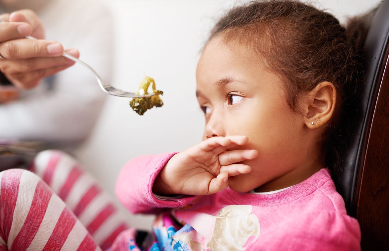 Shot of a little girl refusing to eat her food