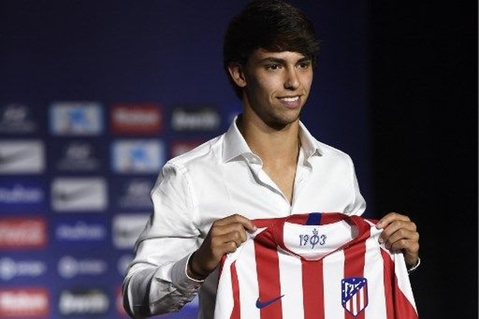 Atletico Madrid's new Portuguese midfielder Joao Felix holds his new jersey during his official presentation at the Wanda Metropolitan stadium in Madrid on July 8, 2019. (Photo by PIERRE-PHILIPPE MARCOU / AFP)