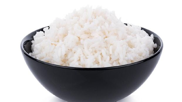 Rice in a bowl on a white background