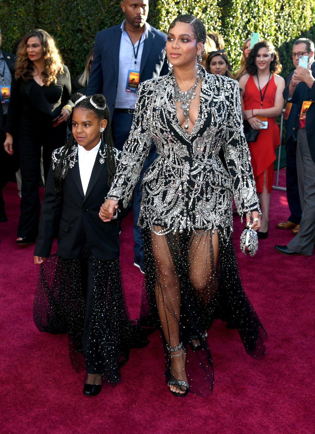 HOLLYWOOD, CALIFORNIA - JULY 09: (L-R) Blue Ivy Carter and BeyoncÃ© attends the premiere of Disney's 
