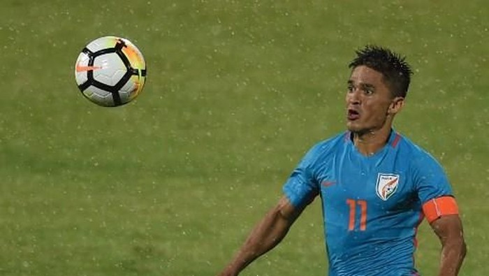 India captain Sunil Chhetri vies for the ball during the Hero Intercontinental Cup football match between India and Kenya in Mumbai on June 4, 2018. - Indias football international against Kenya on June 4  was sold out in hours following captain Sunil Chhetris emotional plea for fans to support the team after barely 2,500 people turned up to watch them play last week. (Photo by PUNIT PARANJPE / AFP)