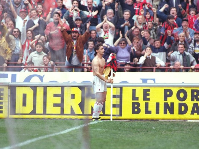 30 Apr 1996:  Roberto Baggio of AC Milan hangs his shirt over a corner post after their victory in the Serie A Scudetta in Milan, Italy. \ Mandatory Credit: Allsport UK /Allsport