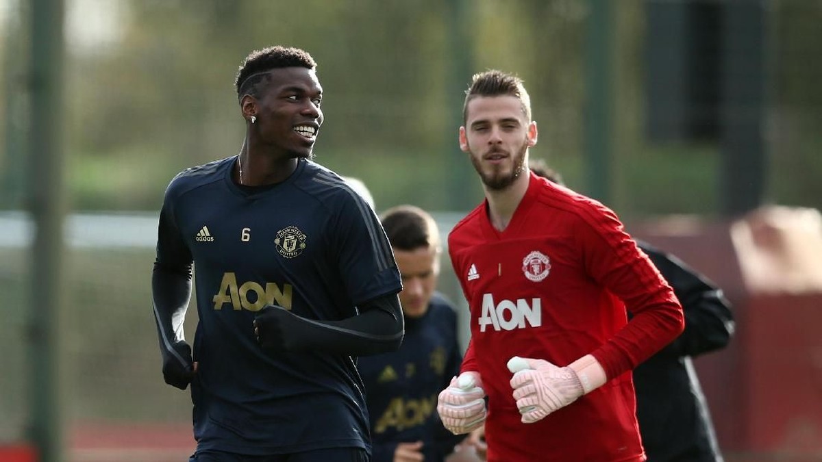 Paul Pogba dan David De Gea. (Foto: Jan Kruger/Getty Images)