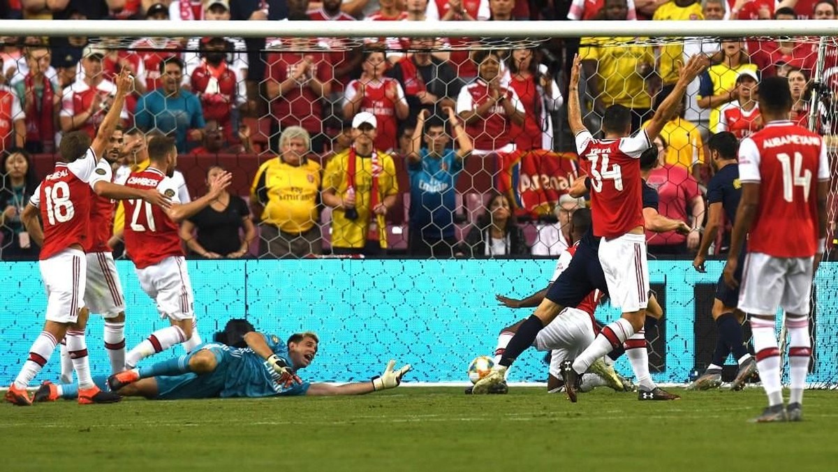 Real Madrid mengalahkan Arsenal lewat adu penalti di ICC 2019. (Foto: Jim Watson / AFP)