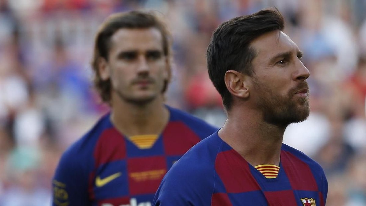 Antoine Griezmann dan Lionel Messi. (Foto: Joan Monfort/AP Photo)