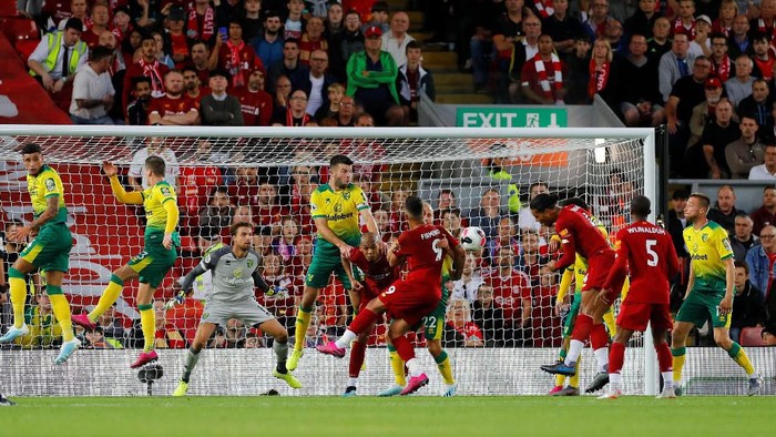 Soccer Football - Premier League - Liverpool v Norwich City - Anfield, Liverpool, Britain - August 9, 2019   Liverpools Virgil van Dijk scores their third goal    REUTERS/Phil Noble    EDITORIAL USE ONLY. No use with unauthorized audio, video, data, fixture lists, club/league logos or live services. Online in-match use limited to 75 images, no video emulation. No use in betting, games or single club/league/player publications.  Please contact your account representative for further details.