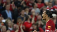 Ekspresi Virgil van Dijk usai mencetak gol. Reuters/Carl Recine.