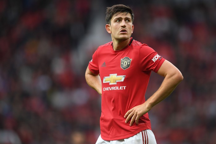 Harry Maguire MANCHESTER, ENGLAND - AUGUST 11: Harry Maguire of Manchester United looks on during the Premier League match between Manchester United and Chelsea FC at Old Trafford on August 11, 2019 in Manchester, United Kingdom. (Photo by Michael Regan/Getty Images)