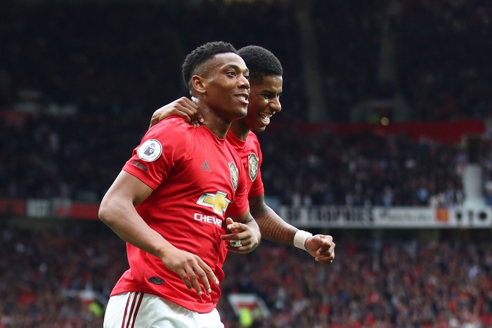 MANCHESTER, ENGLAND - AUGUST 11: Anthony Martial of Manchester United celebrates with teammate Marcus Rashford after scoring his teams second goal during the Premier League match between Manchester United and Chelsea FC at Old Trafford on August 11, 2019 in Manchester, United Kingdom. (Photo by Julian Finney/Getty Images)
