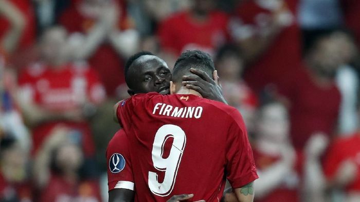 Sadio Mane-Roberto Firmino Liverpools Sadio Mane celebrates with Roberto Firmino, right, after scoring his sides first goal during the UEFA Super Cup soccer match between Liverpool and Chelsea, in Besiktas Park, in Istanbul, Wednesday, Aug. 14, 2019. (AP Photo/Thanassis Stavrakis)