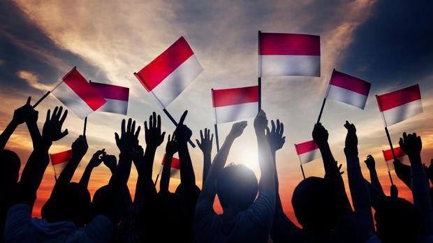 Group of People Waving the Flag of Indonesia