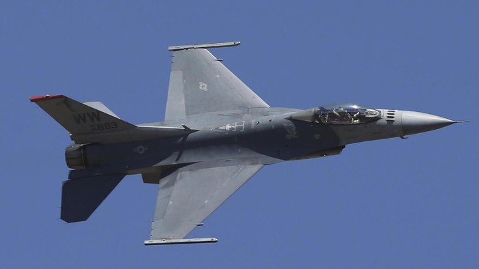 FILE - In this Feb. 24, 2019, file photo, U.S. fighter aircraft F-16 perform aerobatic maneuvers on the last day of Aero India 2019 at Yelahanka air base in Bangalore, India. The Trump administration has informed Congress it plans to sell F-16 fighters worth $8 billion to Taiwan in a move that will inflame already high tensions with China. (AP Photo/Aijaz Rahi, File)