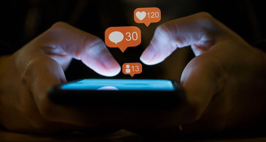 WASHINGTON - JULY 6:  An audience member uses an iPhone to send a tweet during an online Twitter town hall meeting with U.S. President Barack Obama from the East Room of the White House July 6, 2011 in Washington, DC.  Obama and Twitter co-founder and Executive Chairman Jack Dorsey held the online discussion to speak about the U.S .debt ceiling crisis.  (Photo by Brendan Smialowski/Getty Images)