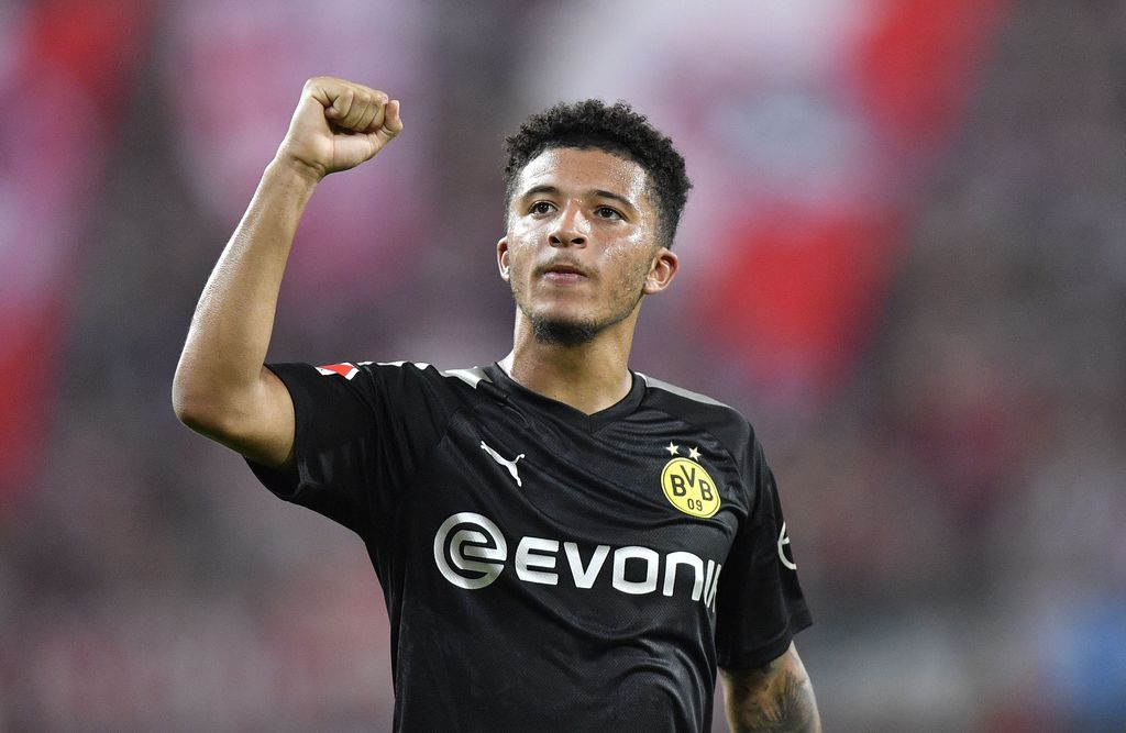 Dortmund's Jadon Sancho celebrates at the end of the German Bundesliga soccer match between FC Cologne and Borussia Dortmund in Cologne, Germany, Friday, Aug.23, 2019. Borussia won 3:1. (AP Photo/Martin Meissner)