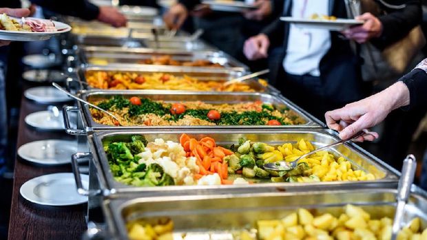 Cuisine Culinary Buffet Dinner Catering Dining Food Celebration Party Concept. Group of people in all you can eat catering buffet food indoor in luxury restaurant with meat and vegetables.