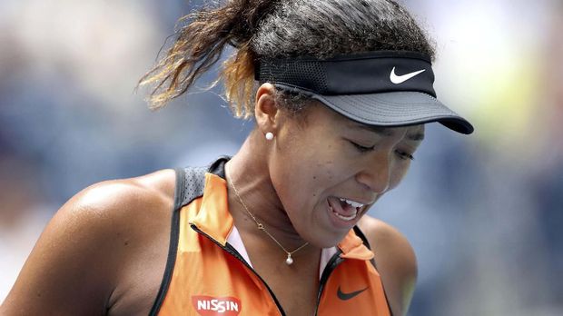 Naomi Osaka, of Japan, reacts after losing a point to Anna Blinkova, of Russia, during the first round of the US Open tennis tournament Tuesday, Aug. 27, 2019, in New York. (AP Photo/Michael Owens)