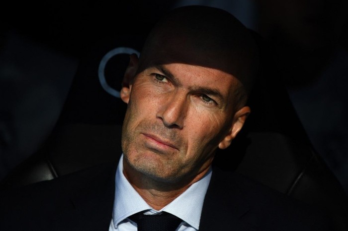 Real Madrids French coach Zinedine Zidane looks on before the Spanish League football match between Real Madrid and Real Valladolid at the Santiago Bernabeu stadium in Madrid on August 24, 2019. (Photo by GABRIEL BOUYS / AFP)