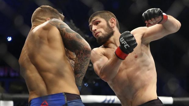 Russian UFC fighter Khabib Nurmagomedov, speaks after wining against UFC fighter Dustin Poirier, of Lafayette, La., during Lightweight title mixed martial arts bout at UFC 242, in Yas Mall in Abu Dhabi, United Arab Emirates, Saturday , Sept.7 2019. (AP Photo/ Mahmoud Khaled)