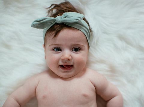 Cute baby girl crawling. Shallow DOF. Developed from RAW; retouched with special care and attention; Small amount of grain added for best final impression. 16 bit Adobe RGB color profile.
