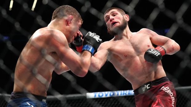 NEW YORK, NY - APRIL 07: Khabib Nurmagomedov (R) lands a right uppercut on Al Iaquinta (L) during their UFC lightweight championship bout at UFC 223 at Barclays Center on April 7, 2018 in New York City. Ed Mulholland/Getty Images/AFP