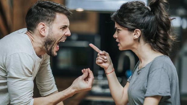 Angry millennial couple arguing shouting blaming each other of problem, frustrated husband and annoyed wife quarreling about bad marriage relationships, unhappy young family fighting at home concept