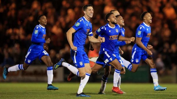 JUDI ONLINE Pemain Colchester United merayakan kemenangan atas Tottenham Hotspur di babak ketiga Piala Liga Inggris 2019/2020.