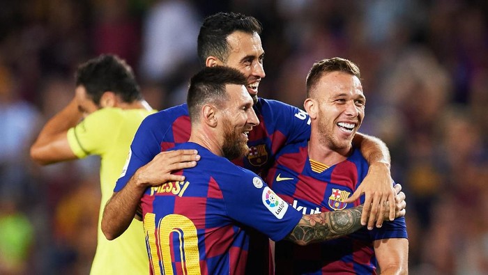 BARCELONA, SPAIN - SEPTEMBER 24: Arthur Melo of FC Barcelona celebrates with his teammates Sergio Busquets and Lionel Messi after scoring his teams second goal during the Liga match between FC Barcelona and Villarreal CF at Camp Nou on September 24, 2019 in Barcelona, Spain. (Photo by Alex Caparros/Getty Images)