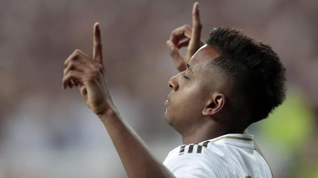Real Madrid's Rodrygo celebrates scoring his side's 2nd goal, during the Spanish La Liga soccer match between Real Madrid and Osasuna at the Santiago Bernabeu stadium in Madrid, Spain, Wednesday, Sept. 25, 2019. (AP Photo/Bernat Armangue)