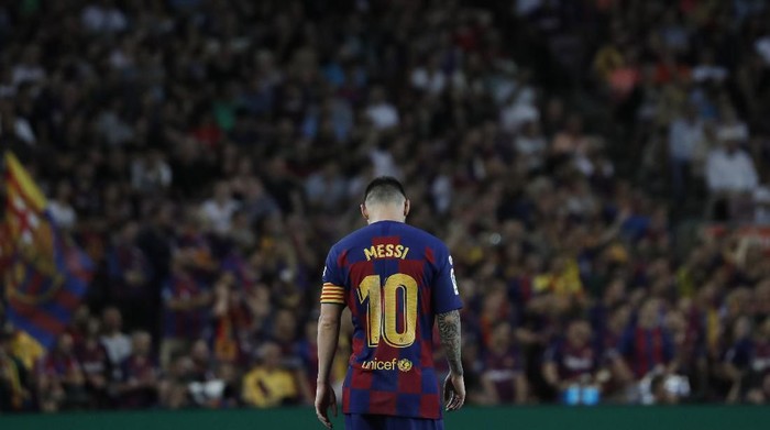 Barcelonas Lionel Messi walks on the pitch during the Spanish La Liga soccer match between FC Barcelona and Villarreal CF at the Camp Nou stadium in Barcelona, Spain, Tuesday, Sep. 24, 2019. (AP Photo/Joan Monfort)