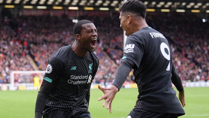 Gelandang Liverpool Georginio Wijnaldum (kiri) merayakan golnya ke gawang Sheffield United di pekan ketujuh Liga Inggris 2019/2020, Sabtu (28/9). (Foto: Laurence Griffiths/Getty Images)