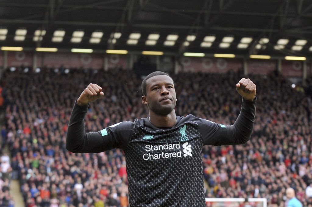 Liverpool's Georginio Wijnaldum celebrates after scoring his side's opening goal during the English Premier League soccer match between Sheffield United and Liverpool at Bramall Lane in Sheffield, England, Saturday, Sept. 28, 2019. (AP Photo/Rui Vieira)
