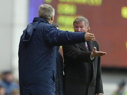 Arsene Wenger (kini) terlibat adu pendapat dengan Sir Alex Ferguson dari Manchester United. (Foto: Clive Mason/Getty Images)