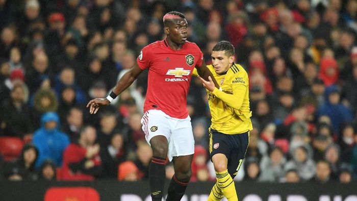 MU vs Arsenal berakhir imbang 1-1. (Foto: Michael Regan/Getty Images) MU vs Arsenal berakhir imbang 1-1. (Foto: Michael Regan/Getty Images)