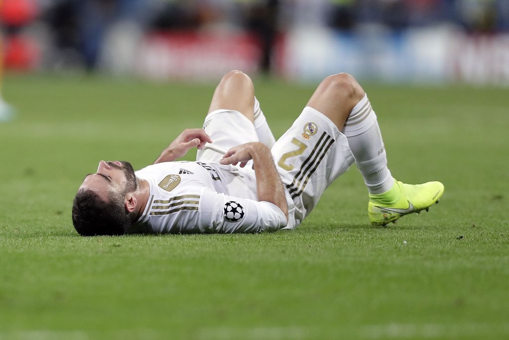 Real Madrid's Dani Carvajal lies on the pitch at the end of the Champions League group A soccer match between Real Madrid and Club Brugge, at the Santiago Bernabeu stadium in Madrid, Tuesday, Oct.1, 2019. (AP Photo/Manu Fernandez)