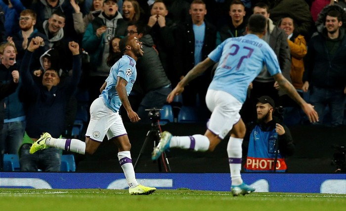 Soccer Football - Champions League - Group C - Manchester City v GNK Dinamo Zagreb - Etihad Stadium, Manchester, Britain - October 1, 2019  Manchester Citys Raheem Sterling celebrates scoring their first goal with Joao Cancelo   REUTERS/Andrew Yates