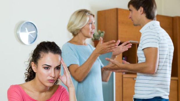 Upset girl apart from her husband and senior mother quarrelling
