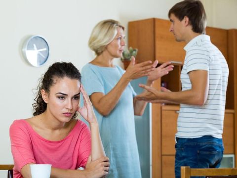 Upset girl apart from her husband and senior mother quarrelling