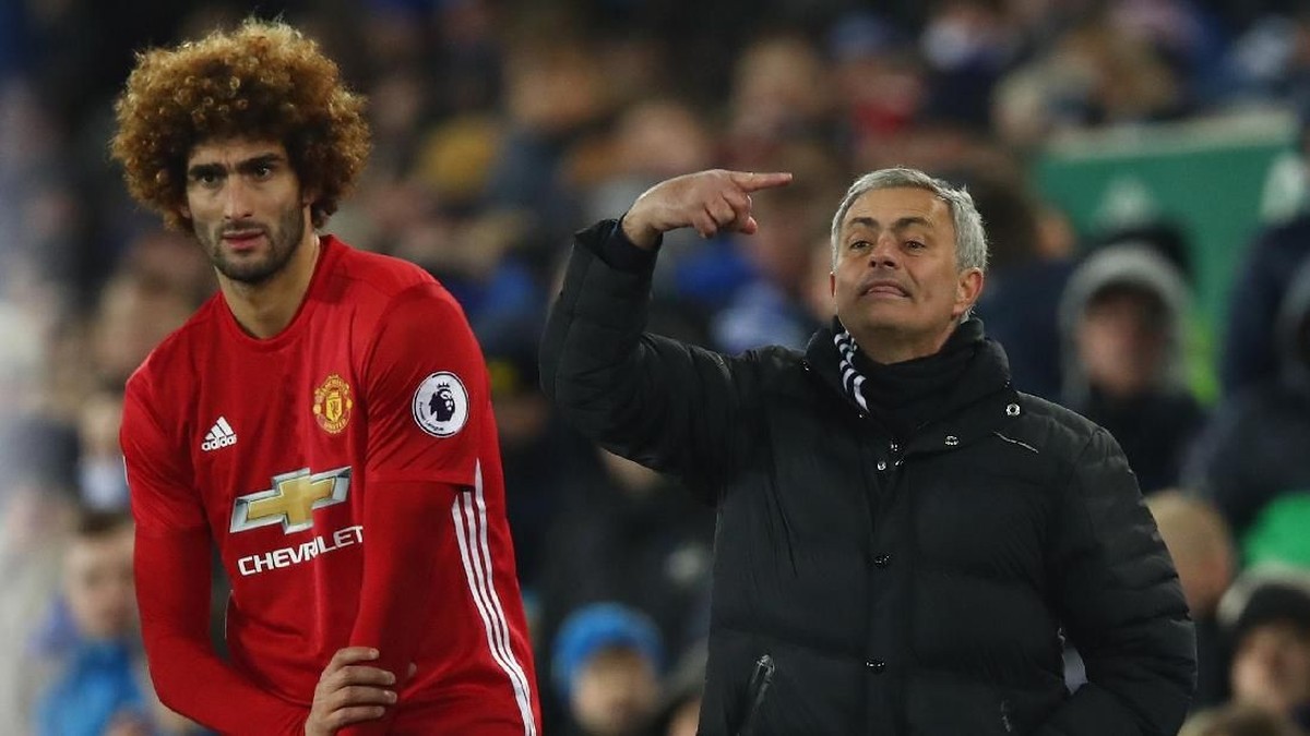 Jose Mourinho dan Marouane Fellaini ketika masih bersama di Manchester United. (Foto: Clive Brunskill/Getty Images)
