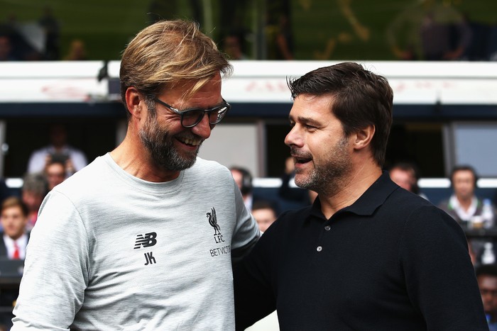 LONDON, ENGLAND - AUGUST 27: Jurgen Klopp, Manager of Liverpool and Mauricio Pochettino, Manager of Tottenham Hotspur exchange words piror to kick off during the Premier League match between Tottenham Hotspur and Liverpool at White Hart Lane on August 27, 2016 in London, England.  (Photo by Jan Kruger/Getty Images)