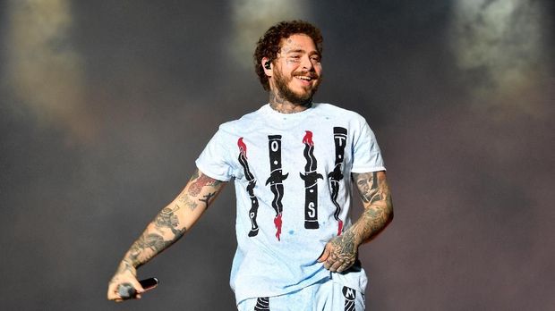 US singer, rapper, songwriter and producer Post Malone performs on stage at the 