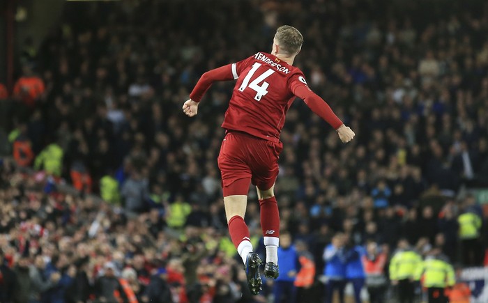 Liverpools Jordan Henderson celebrates after scoring his sides opening goal during the English Premier League soccer match between Liverpool and Tottenham Hotspur at Anfield stadium in Liverpool, England, Sunday, Oct. 27, 2019. (AP Photo/Jon Super)