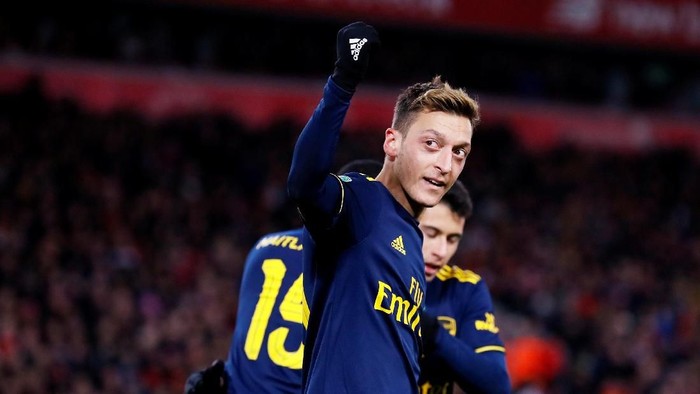 Soccer Football - Carabao Cup - Fourth Round - Liverpool v Arsenal - Anfield, Liverpool, Britain - October 30, 2019  Arsenals Mesut Ozil celebrates their fourth goal   Action Images via Reuters/Jason Cairnduff  EDITORIAL USE ONLY. No use with unauthorized audio, video, data, fixture lists, club/league logos or live services. Online in-match use limited to 75 images, no video emulation. No use in betting, games or single club/league/player publications.  Please contact your account representative for further details.