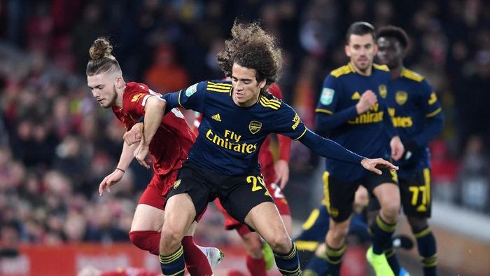 Liverpool vs Arsenal LIVERPOOL, ENGLAND - OCTOBER 30: Matteo Guendouzi of Arsenal is challenged by Harvey Elliott of Liverpool during the Carabao Cup Round of 16 match between Liverpool and Arsenal at Anfield on October 30, 2019 in Liverpool, England. (Photo by Laurence Griffiths/Getty Images)